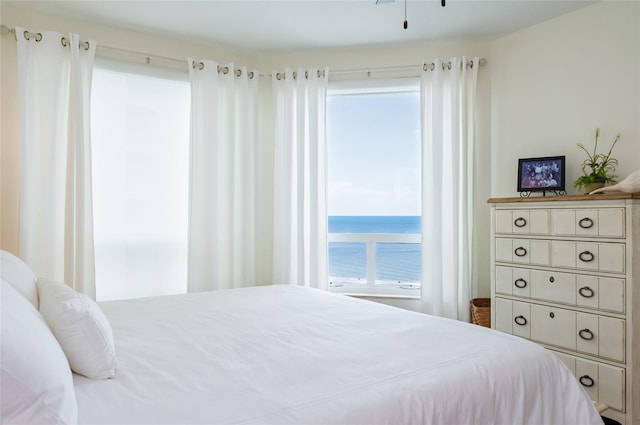 bedroom featuring a water view