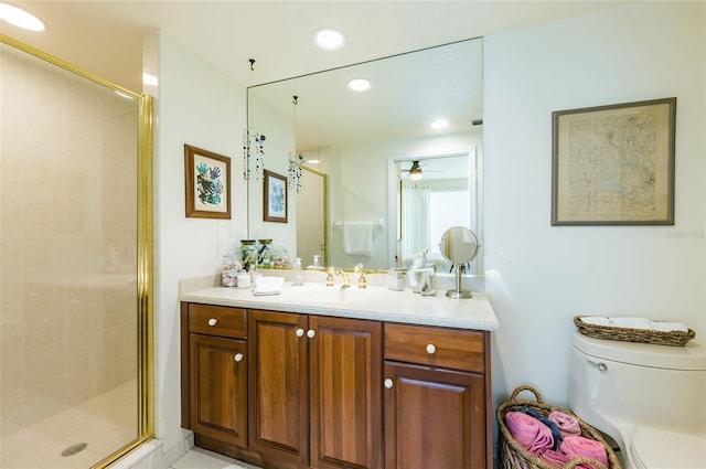 bathroom featuring ceiling fan, vanity, walk in shower, and toilet