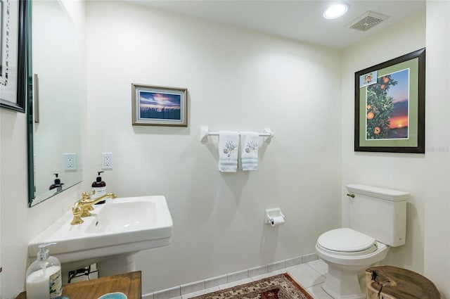 bathroom with tile patterned floors and toilet