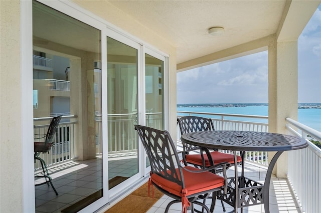 balcony featuring a water view