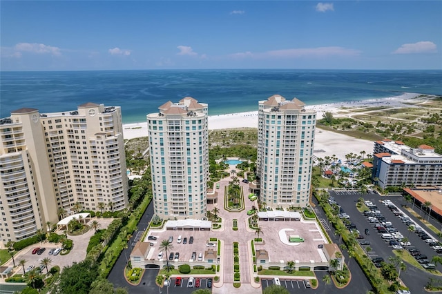 bird's eye view with a water view and a view of the beach