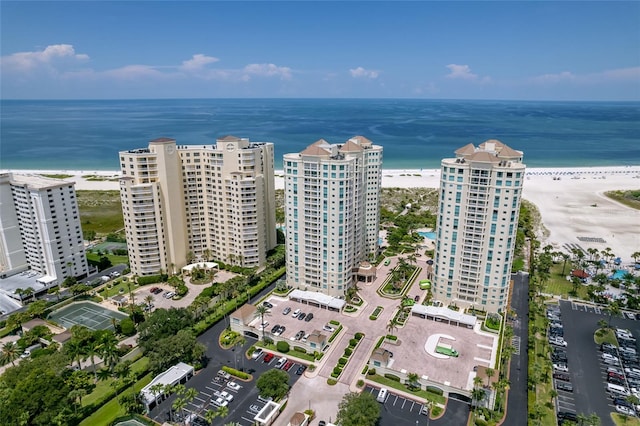 birds eye view of property featuring a water view and a view of the beach