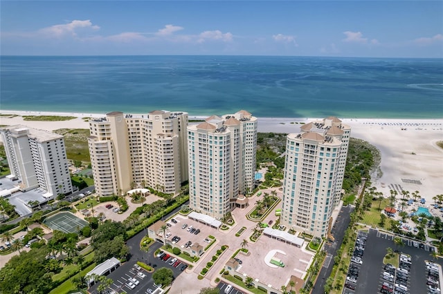 aerial view featuring a water view and a beach view