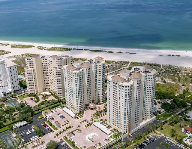 drone / aerial view with a water view and a view of the beach