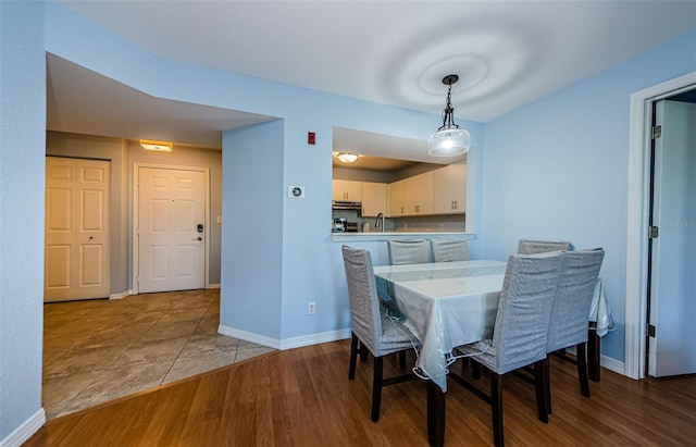 dining area with hardwood / wood-style floors