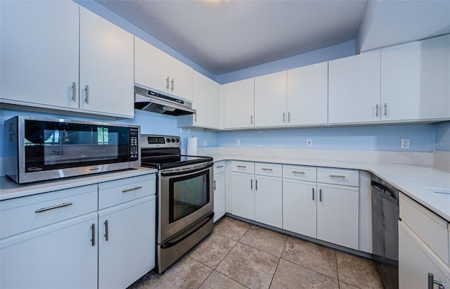 kitchen featuring white cabinetry, appliances with stainless steel finishes, and light tile patterned flooring