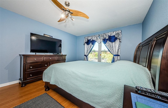 bedroom featuring ceiling fan and light wood-type flooring