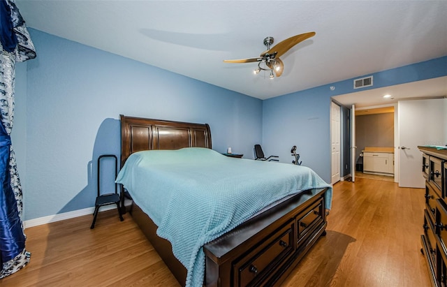 bedroom with light hardwood / wood-style floors and ceiling fan
