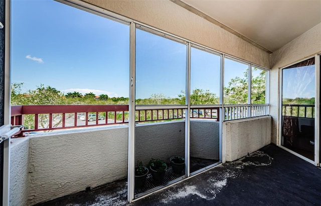 unfurnished sunroom with plenty of natural light