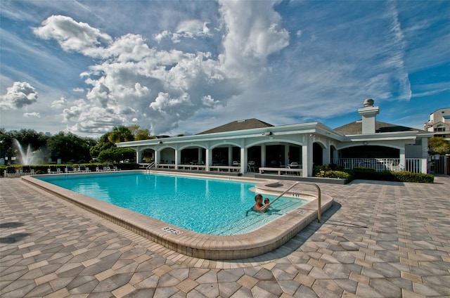 view of pool featuring a patio