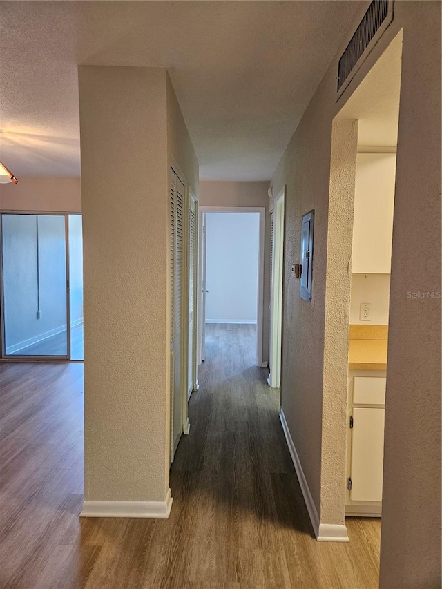 hallway featuring hardwood / wood-style flooring