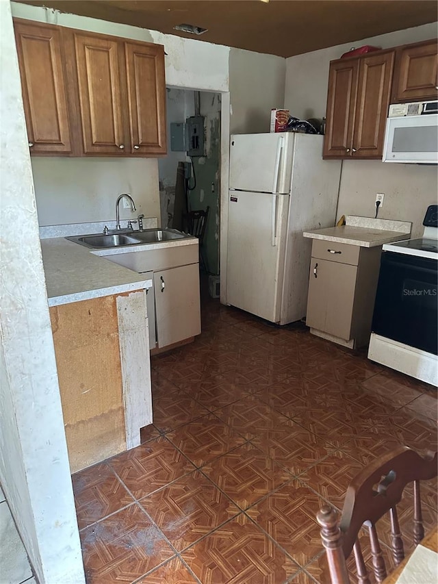 kitchen with white appliances and sink