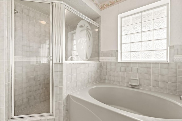 bathroom with separate shower and tub