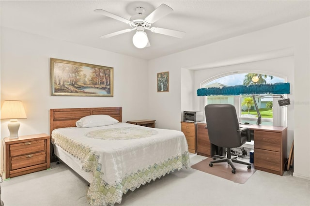 bedroom featuring ceiling fan and light colored carpet