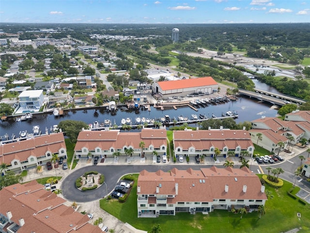 bird's eye view featuring a water view and a residential view