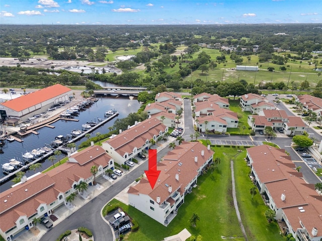 bird's eye view featuring a water view and a residential view