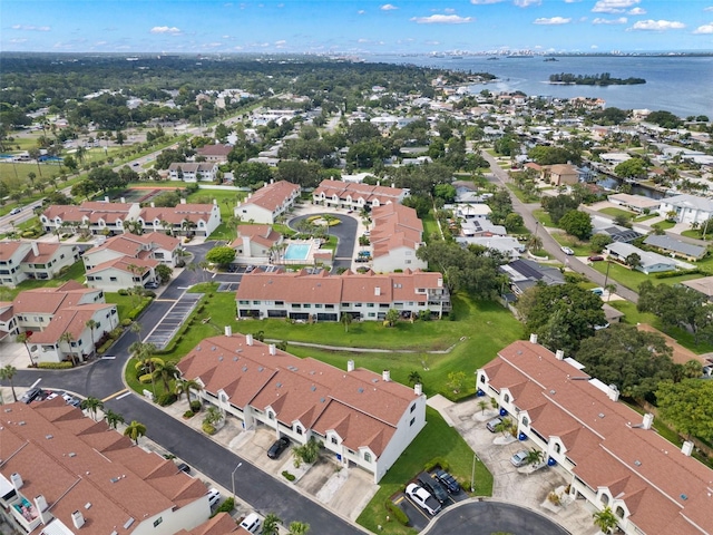 birds eye view of property featuring a water view and a residential view