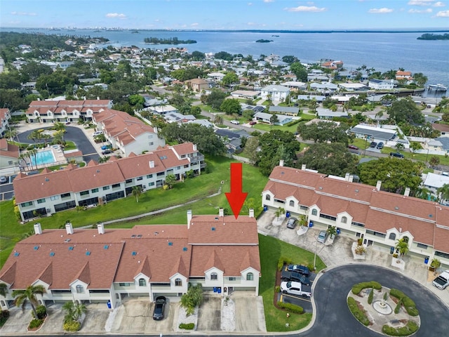 birds eye view of property featuring a water view and a residential view