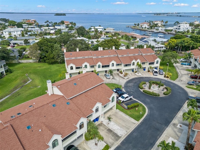 birds eye view of property featuring a residential view and a water view