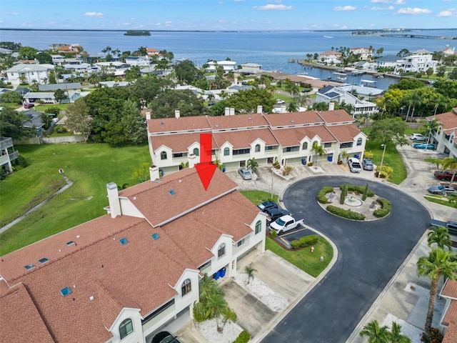 bird's eye view with a water view and a residential view