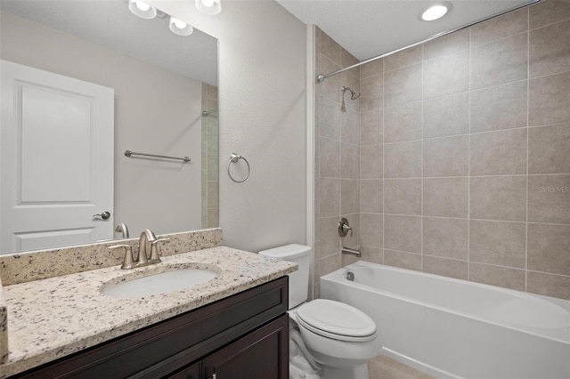 full bathroom with shower / washtub combination, vanity, and toilet