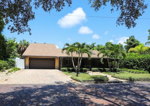 ranch-style home with a garage