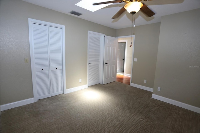 unfurnished bedroom featuring ceiling fan and hardwood / wood-style flooring