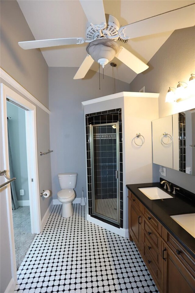 bathroom featuring toilet, tile patterned floors, vanity, and ceiling fan