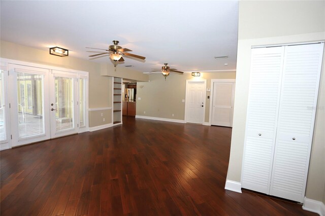 unfurnished living room with ceiling fan, french doors, and wood-type flooring