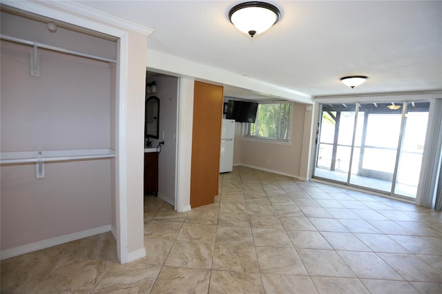 interior space with crown molding