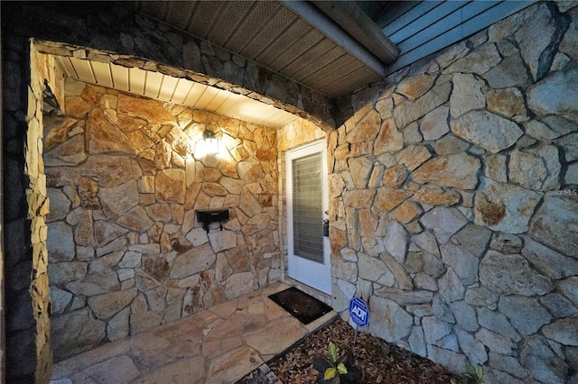 view of exterior entry with stone siding