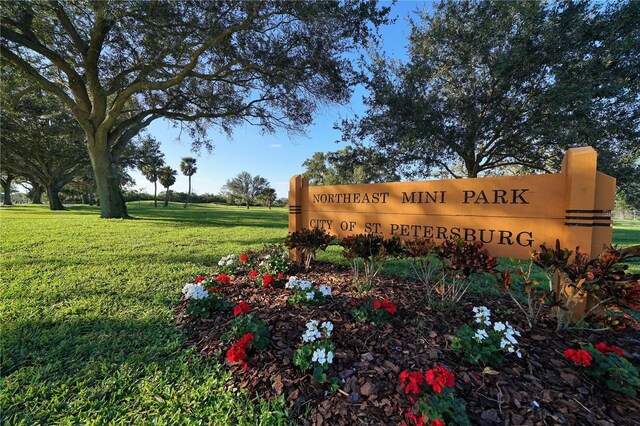 community / neighborhood sign with a lawn