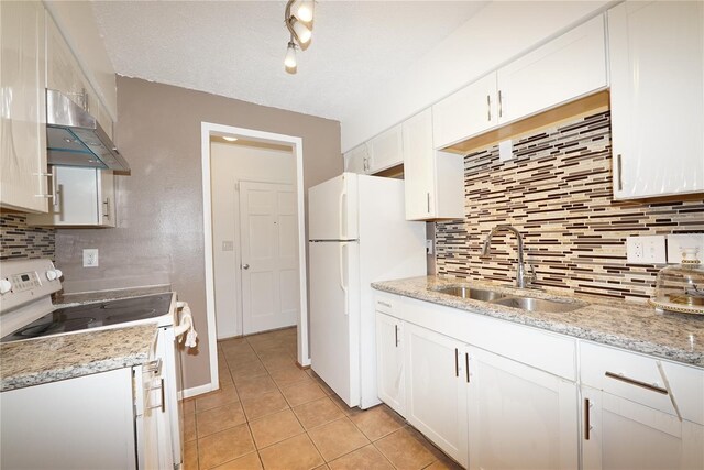 kitchen with backsplash, sink, white appliances, and white cabinets