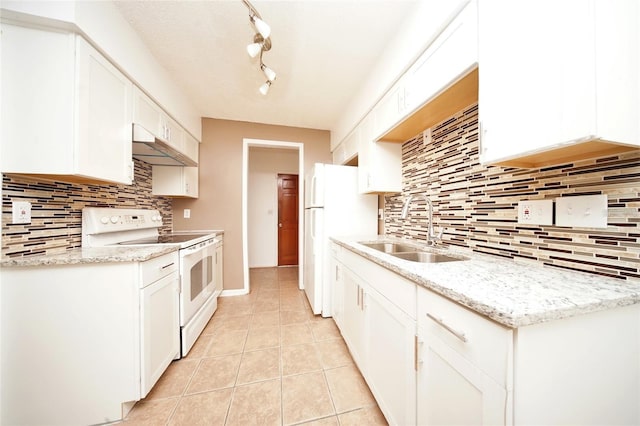 kitchen with tasteful backsplash, sink, white electric stove, white cabinets, and track lighting