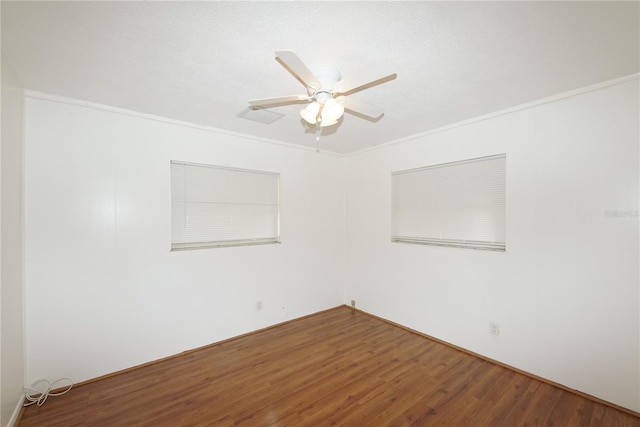 unfurnished room with ceiling fan and hardwood / wood-style flooring