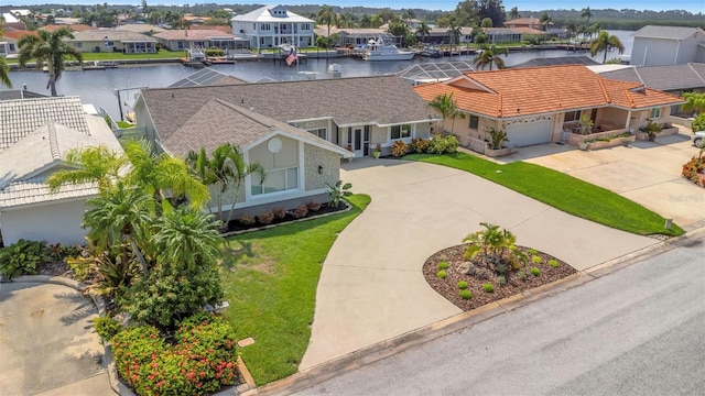 birds eye view of property featuring a water view