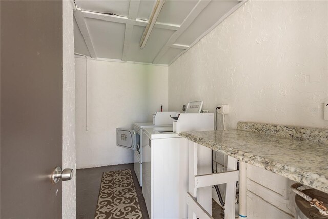 laundry area with washing machine and clothes dryer