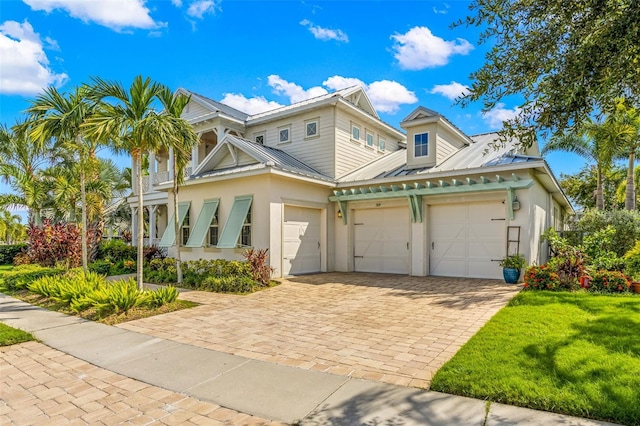 view of front facade with a front lawn and a garage