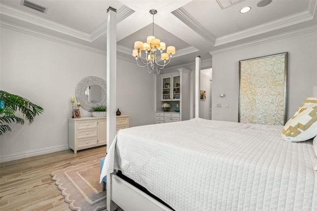 bedroom featuring a chandelier, coffered ceiling, light hardwood / wood-style floors, ornamental molding, and decorative columns