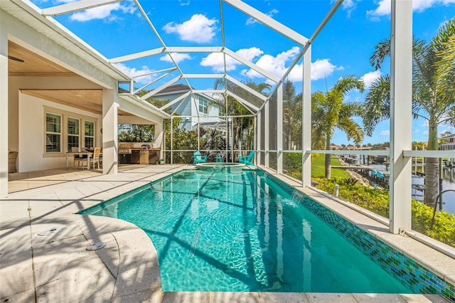 view of pool featuring a lanai and a patio area