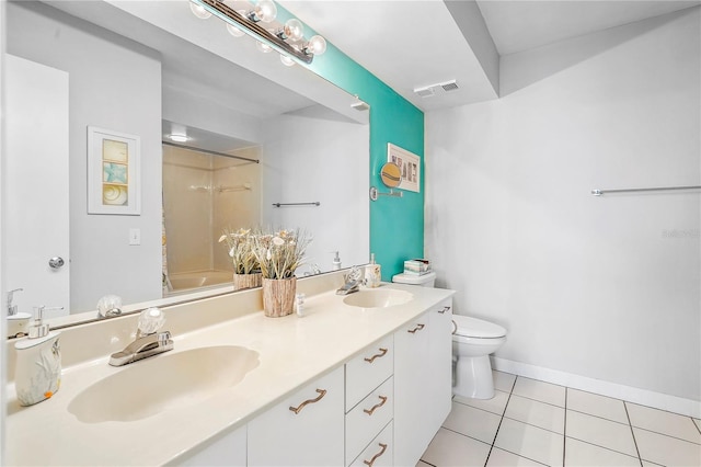 full bathroom featuring vanity, tile patterned floors, toilet, and washtub / shower combination