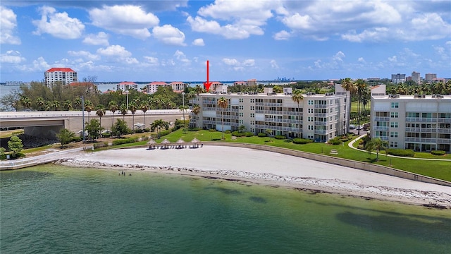 birds eye view of property featuring a water view and a view of the beach