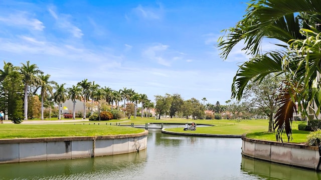 surrounding community featuring a yard and a water view