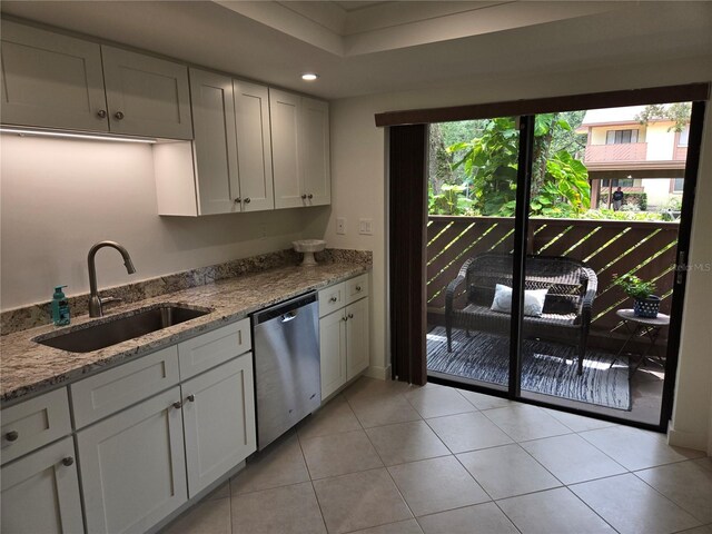 kitchen featuring sink, white cabinets, plenty of natural light, and dishwasher