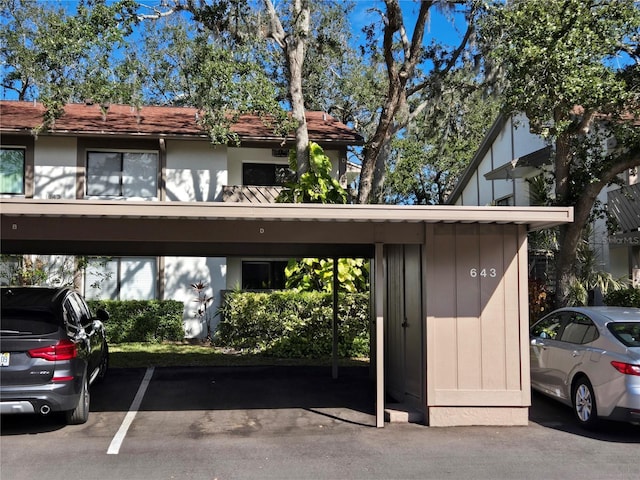 view of vehicle parking featuring a carport