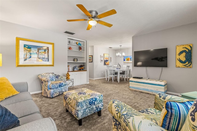 carpeted living area featuring visible vents, baseboards, and ceiling fan with notable chandelier