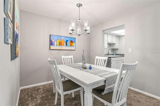 carpeted dining area with a chandelier, a sink, and baseboards