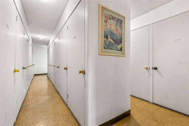 hall with light tile patterned floors