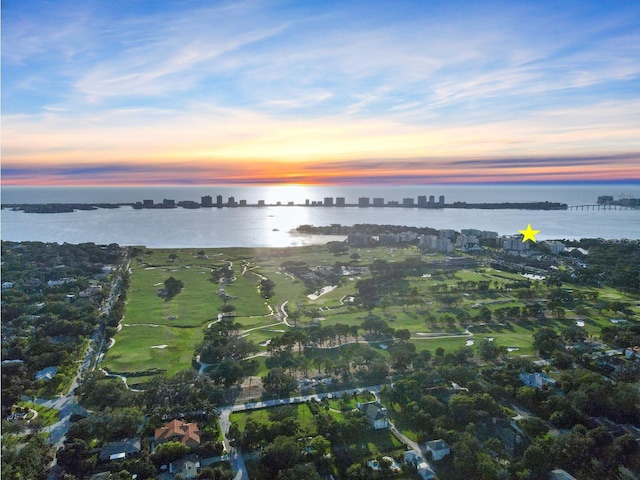 aerial view at dusk with a water view