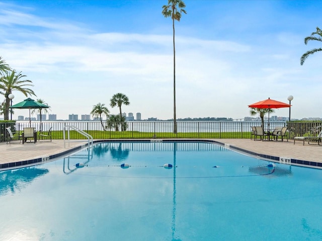 view of swimming pool with a patio